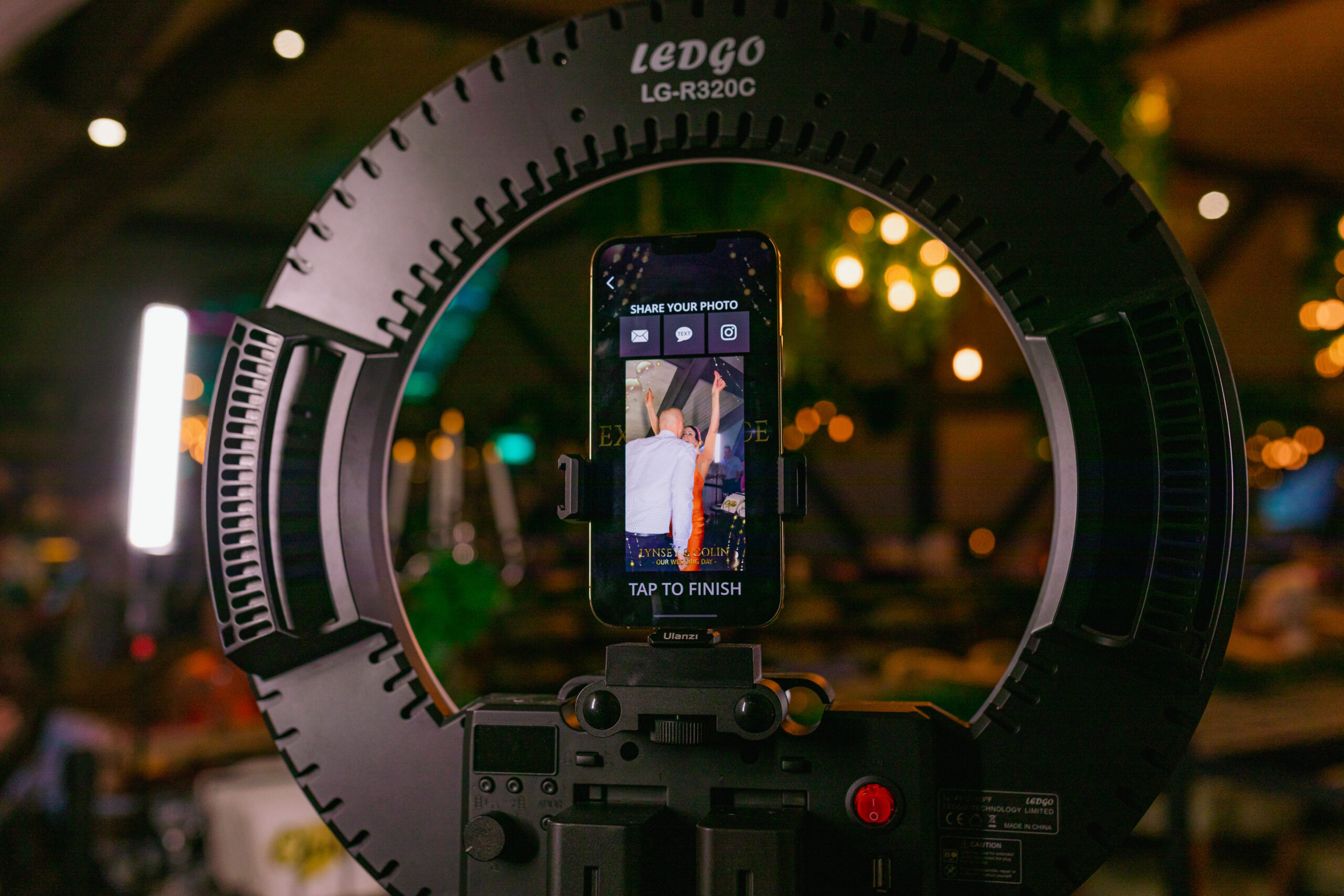 Selfie station with props for guests at a wedding celebration