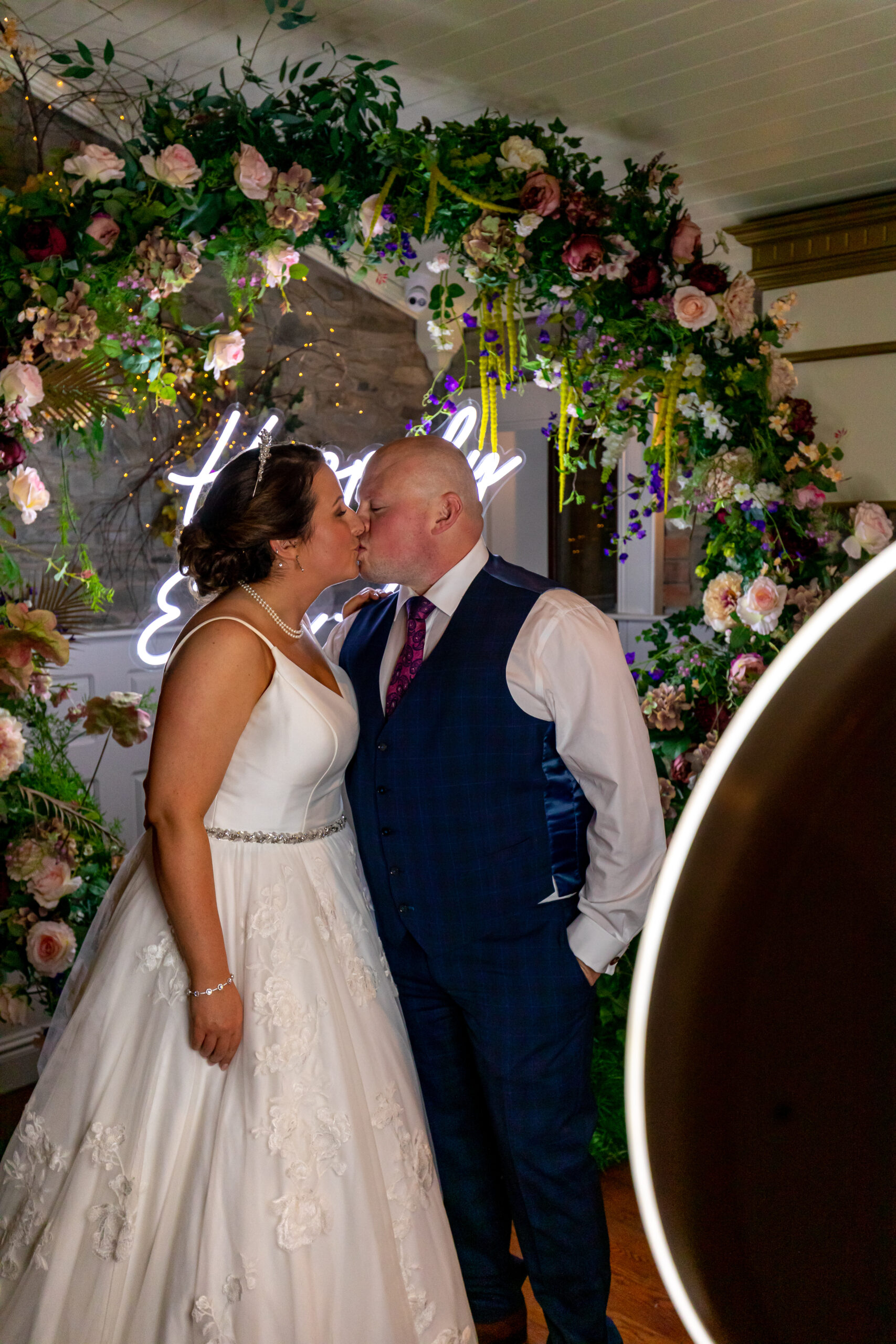 360 photo booth setup at a wedding event with guests enjoying entertainment