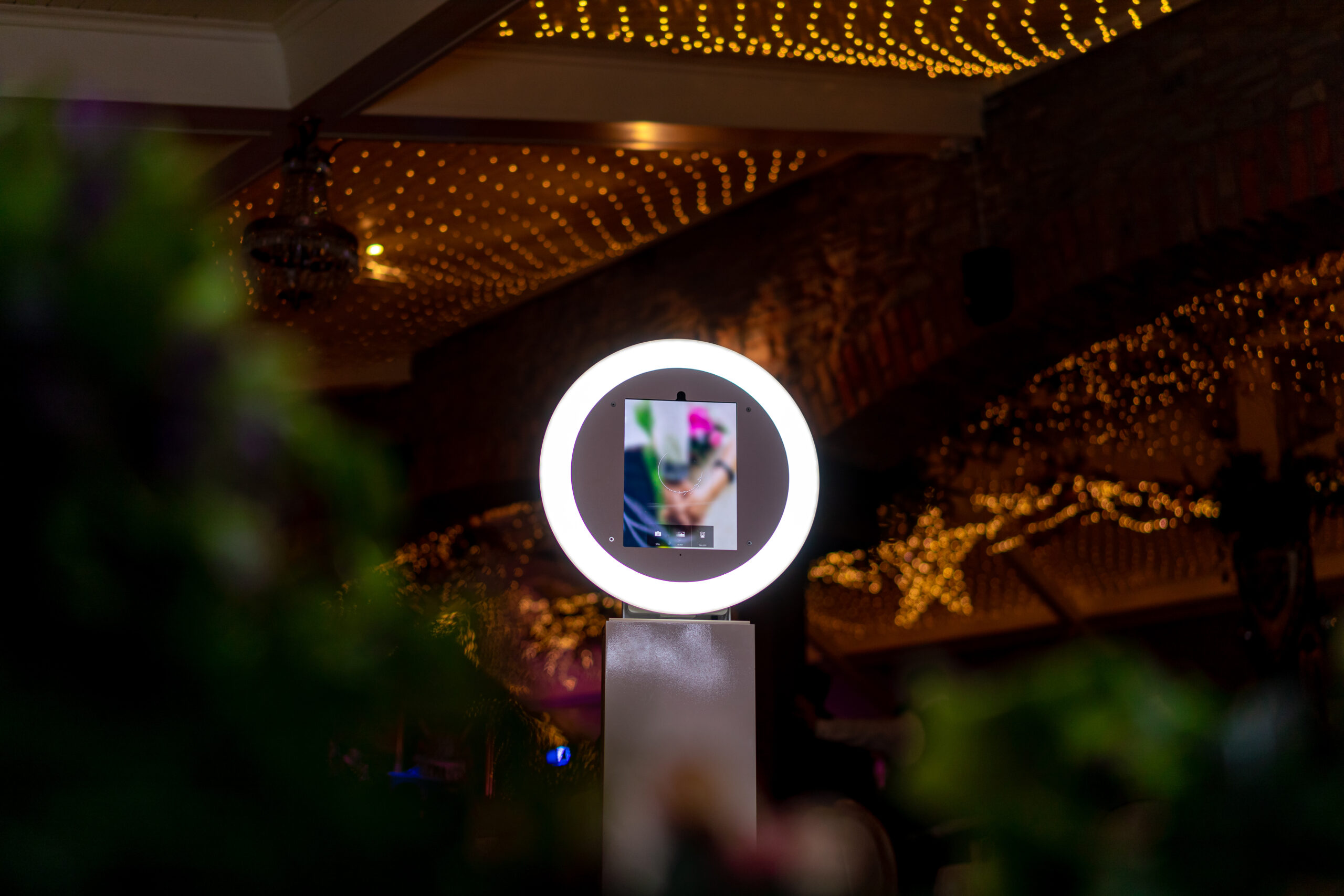 Mirror booth with interactive screen at a party entertainment setup