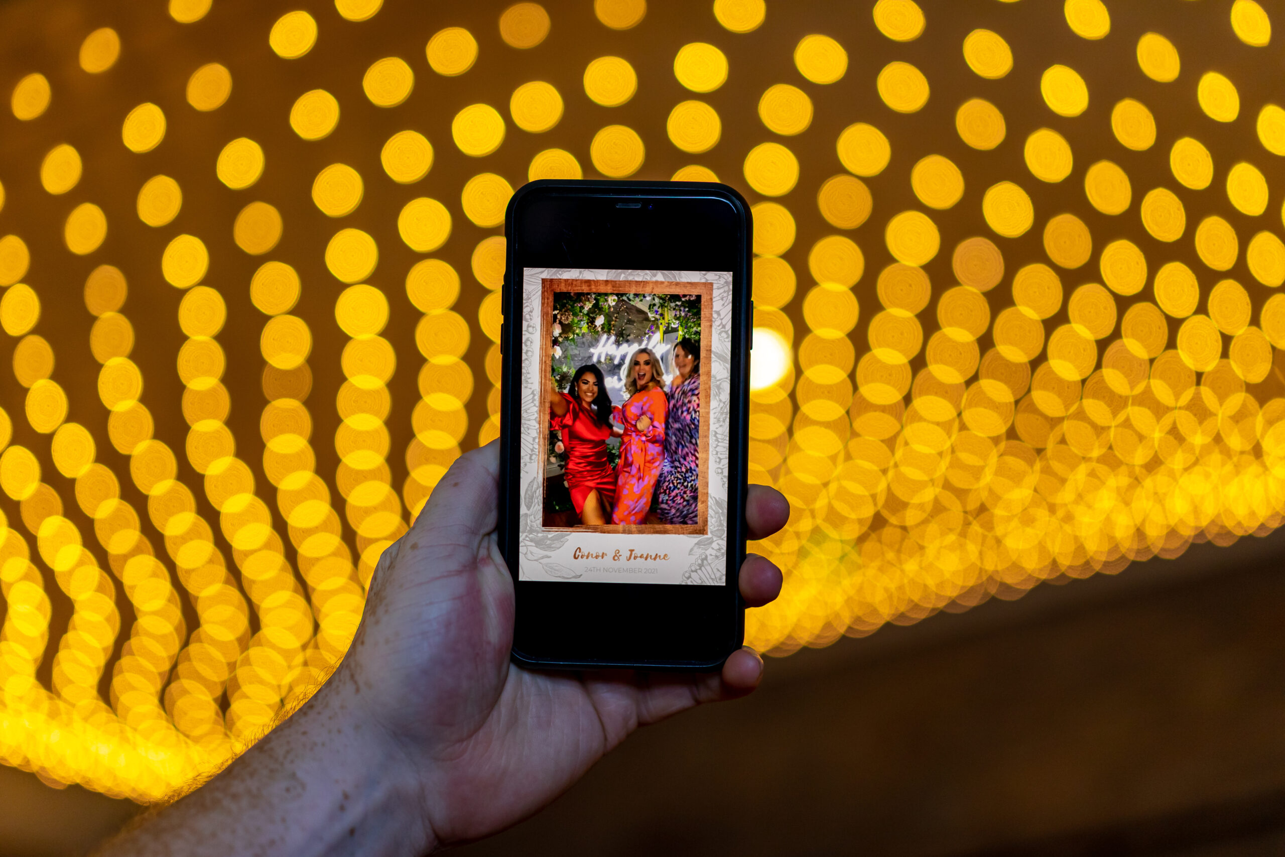 Selfie station with props for guests at a wedding celebration