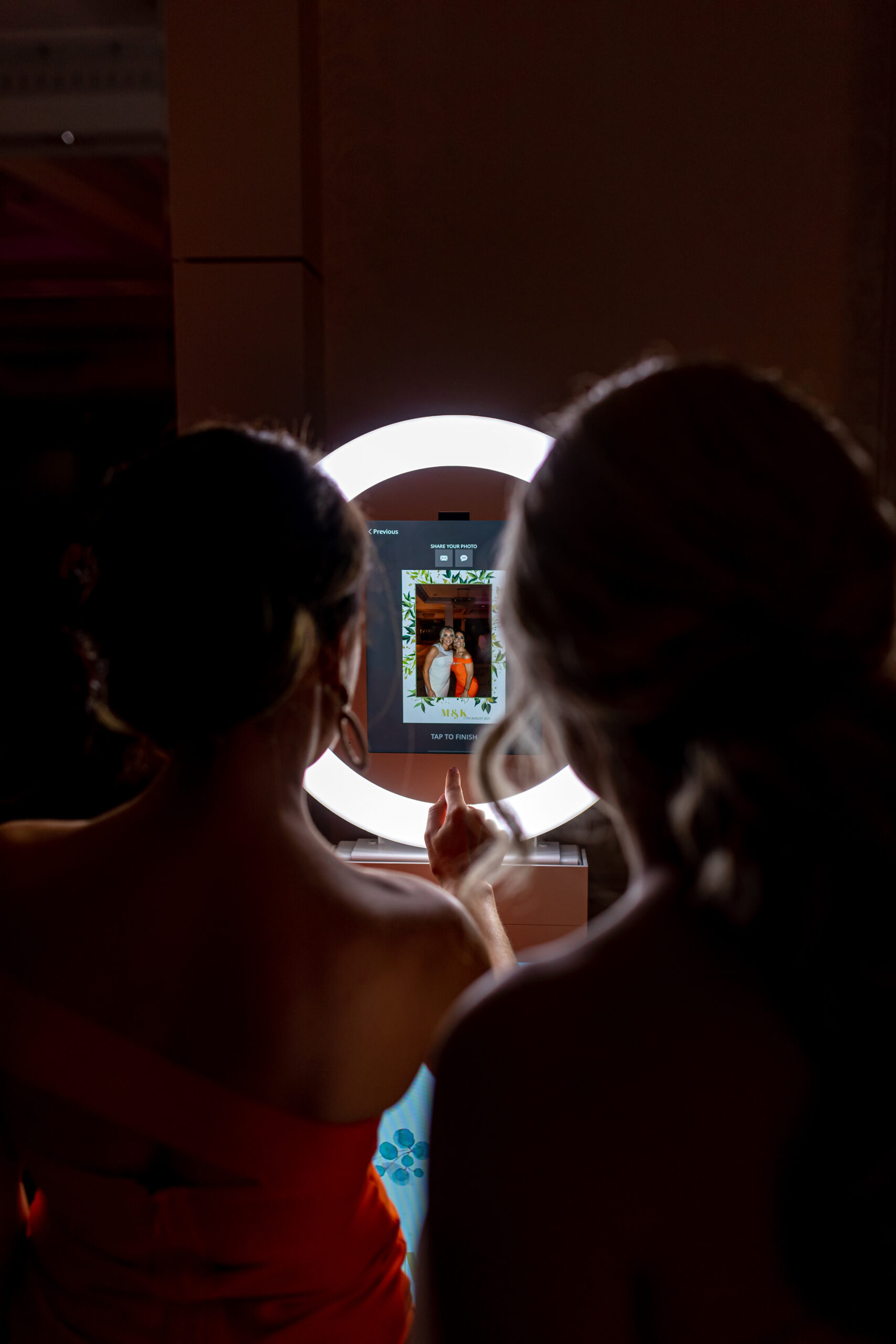 Selfie station with props for guests at a wedding celebration