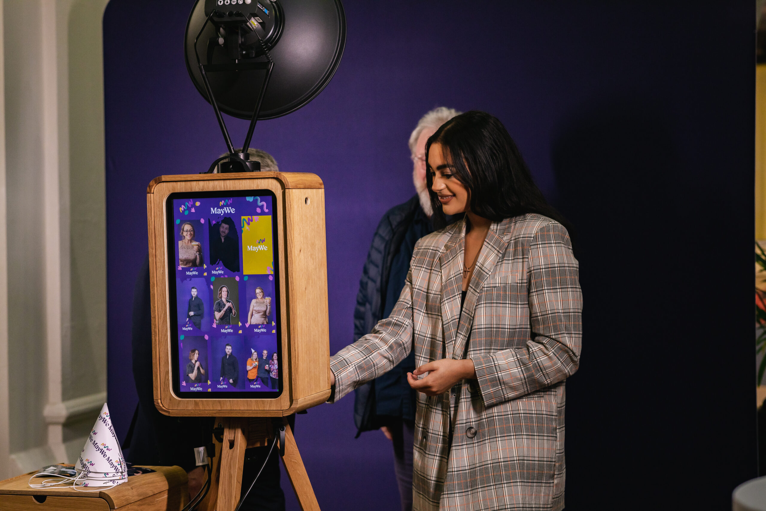 360 photo booth setup at a wedding event with guests enjoying entertainment