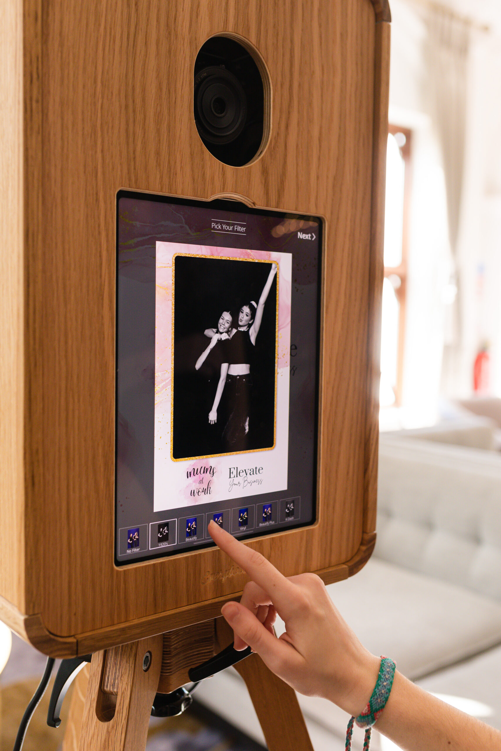 360 photo booth setup at a wedding event with guests enjoying entertainment